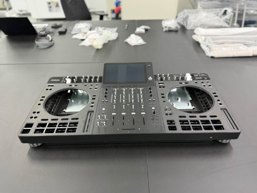 Behringer DJ controller prototype featuring four-channel mixer, touchscreen and performance pads